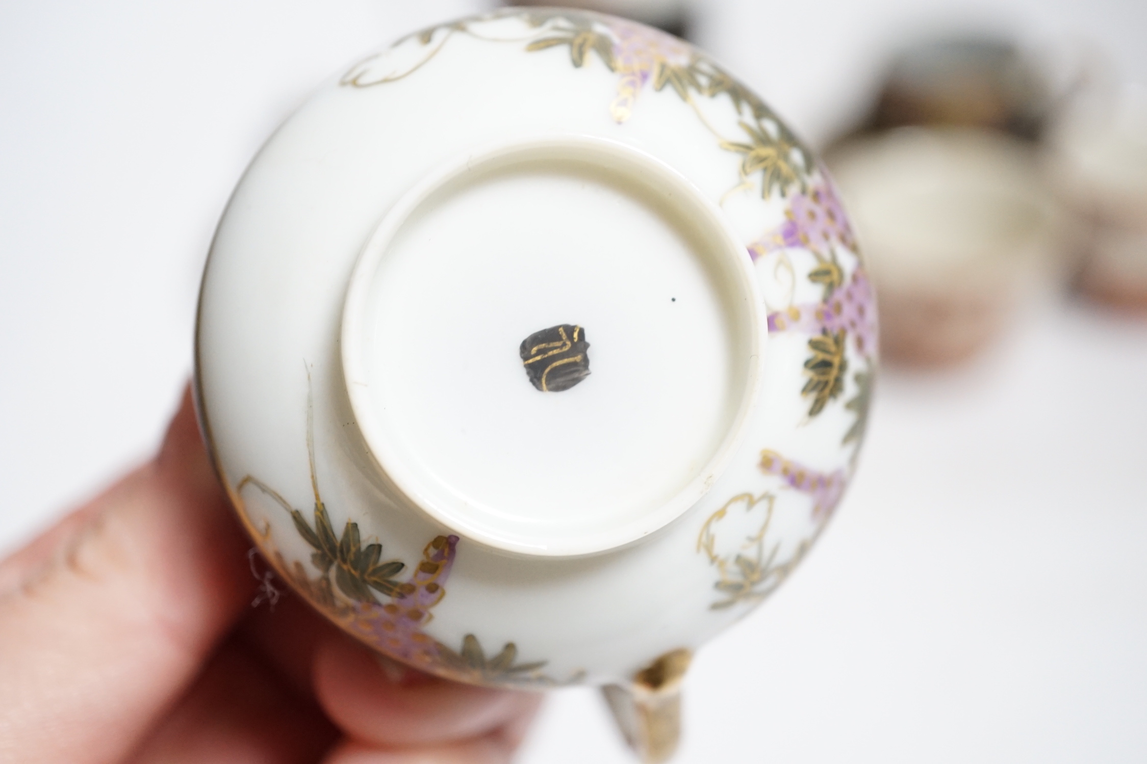 Two Japanese Kutani tea bowls, 19th century and a Japanese egg shell part tea set